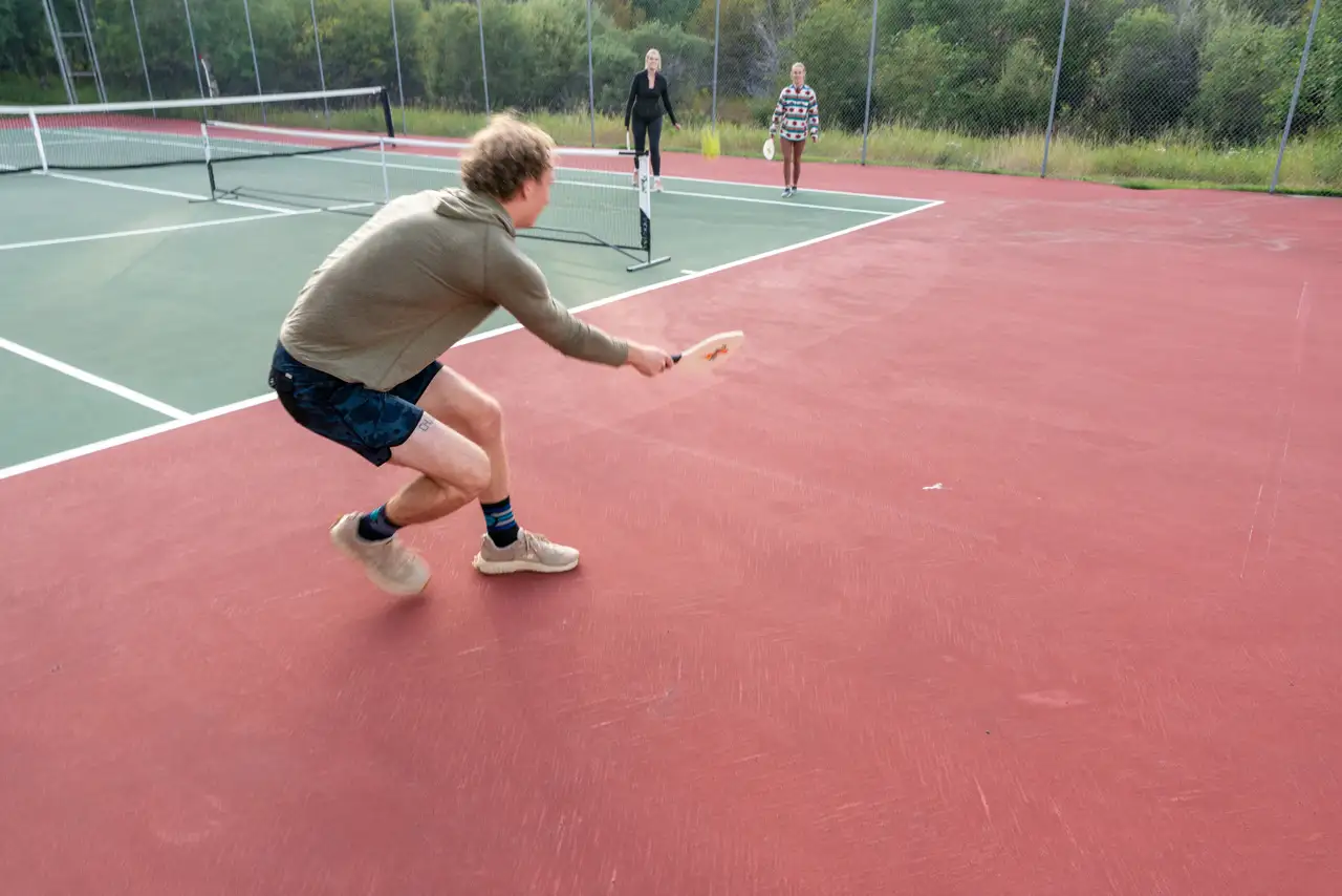 A man playing tennis on a court