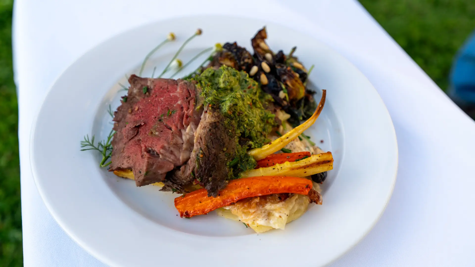 A plate of food with meat and vegetables