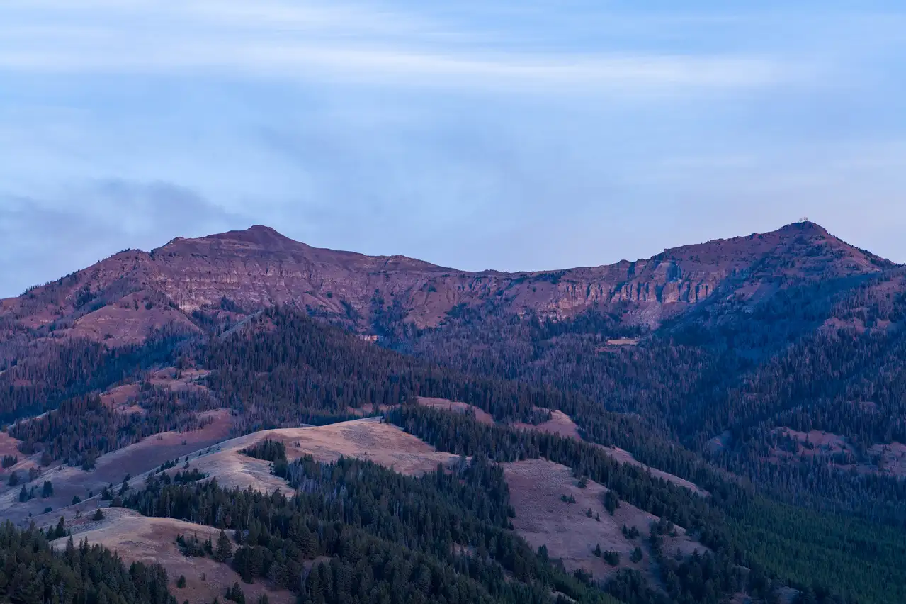 A mountain range with a blue sky above it