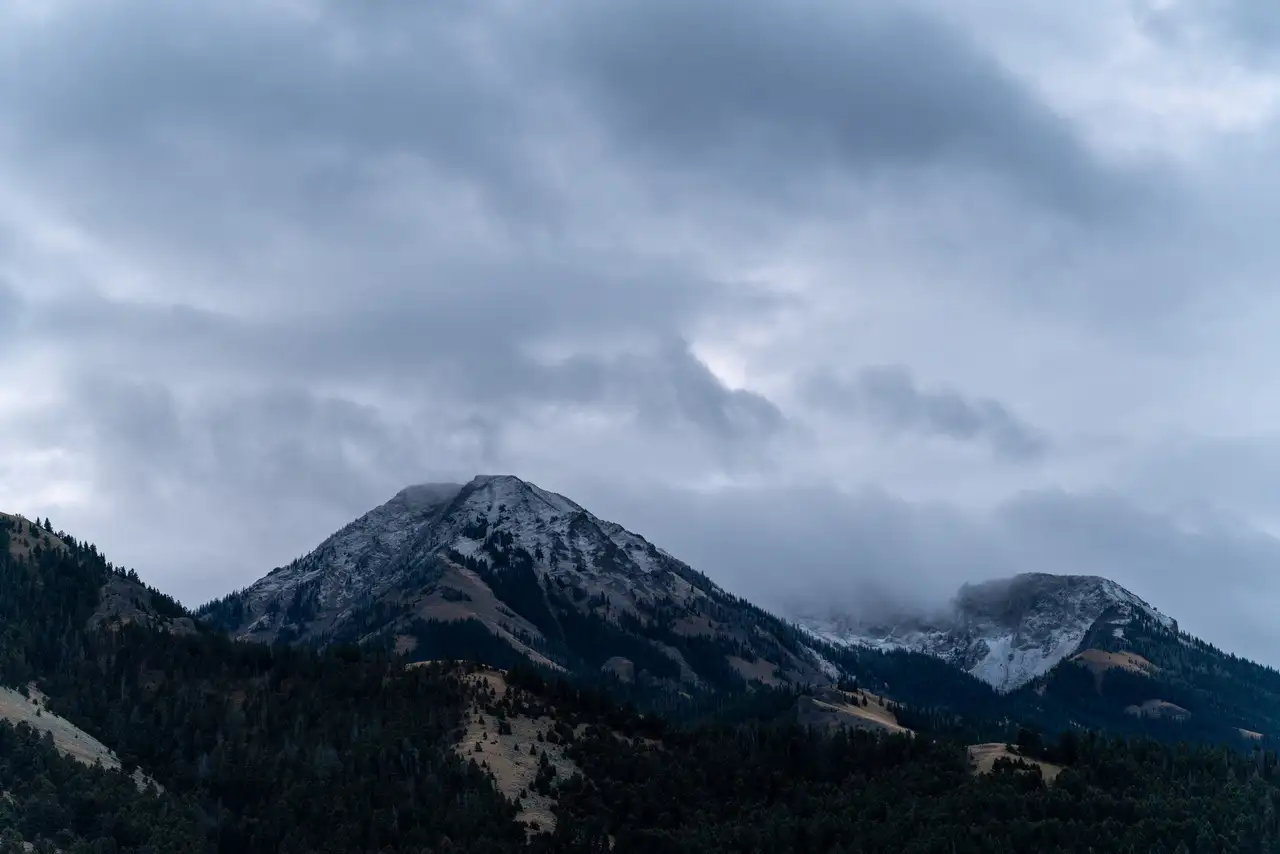 A snowy mountain in the clouds