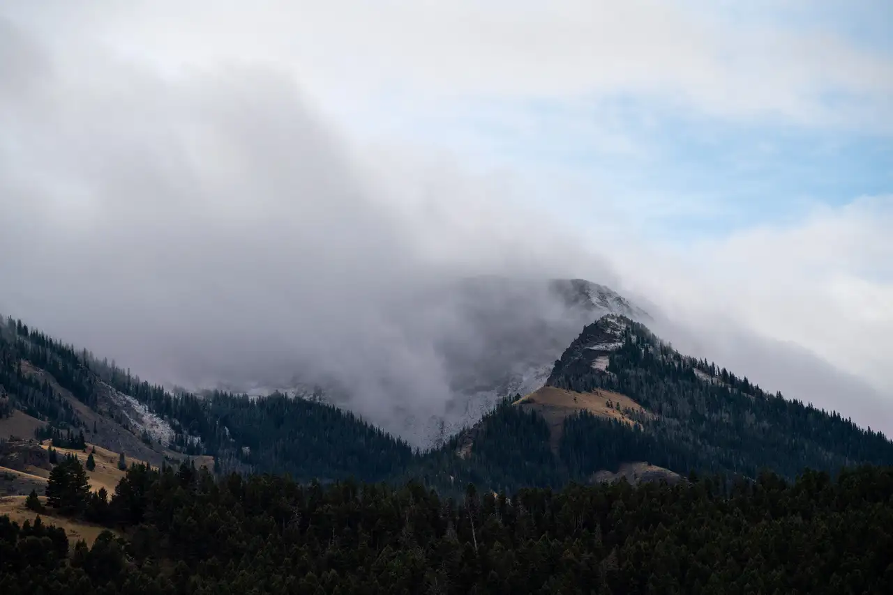 A snowy mountain in the clouds