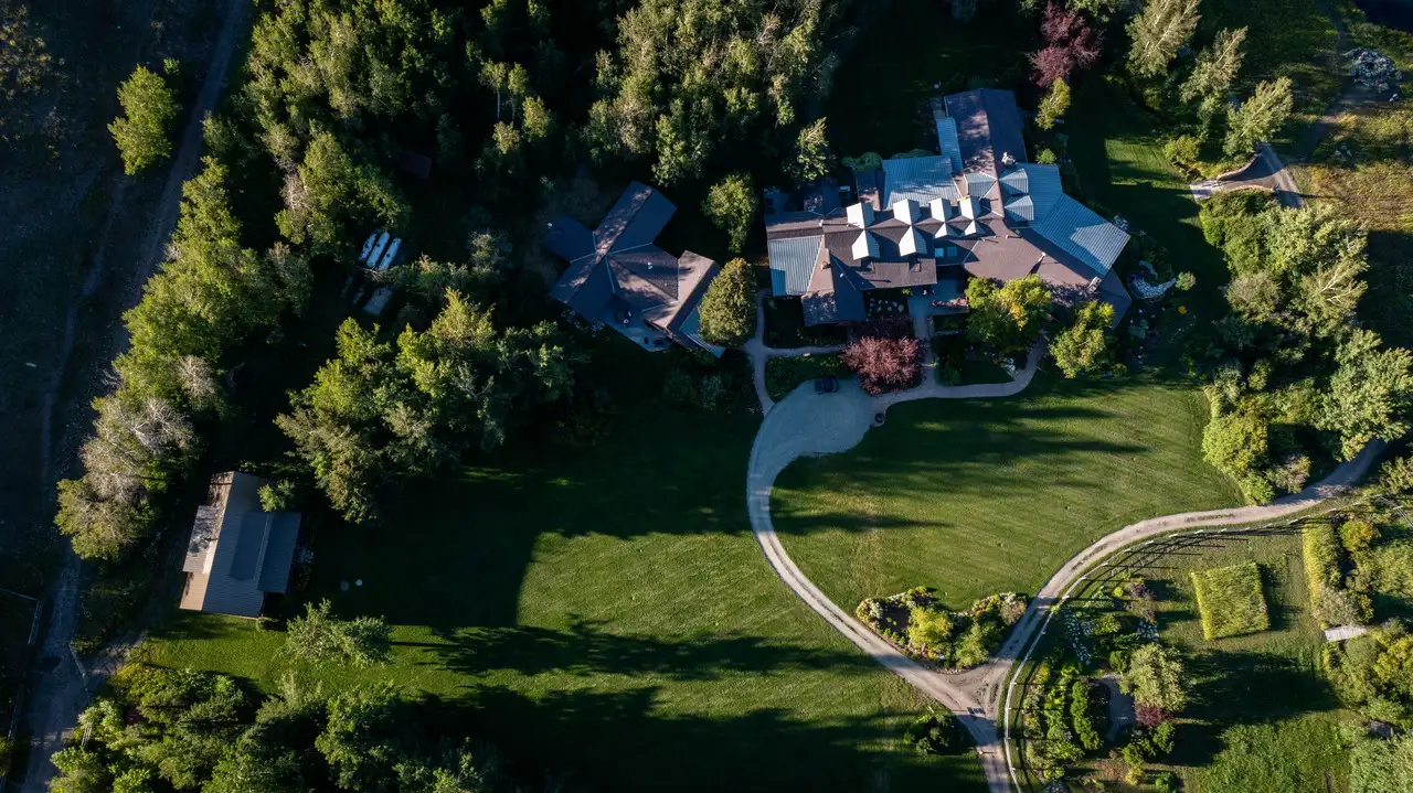 A house with a circular driveway and a heart-shaped design