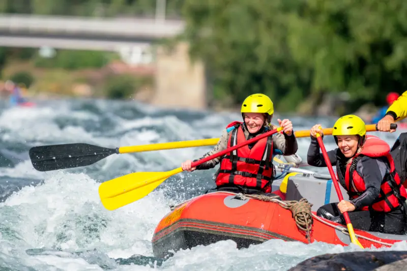 Two people in a raft on a river