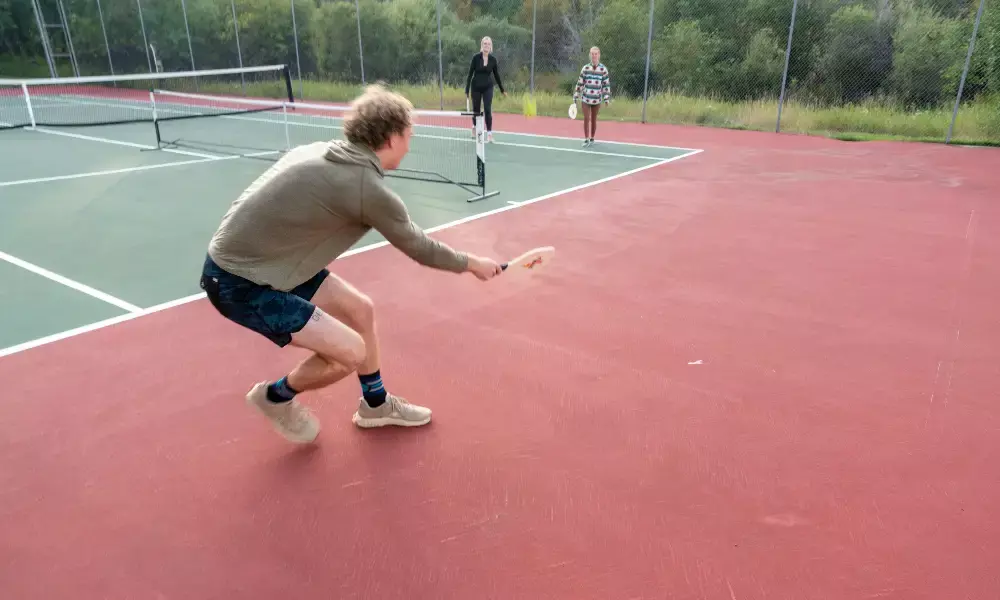 A man playing tennis on a court