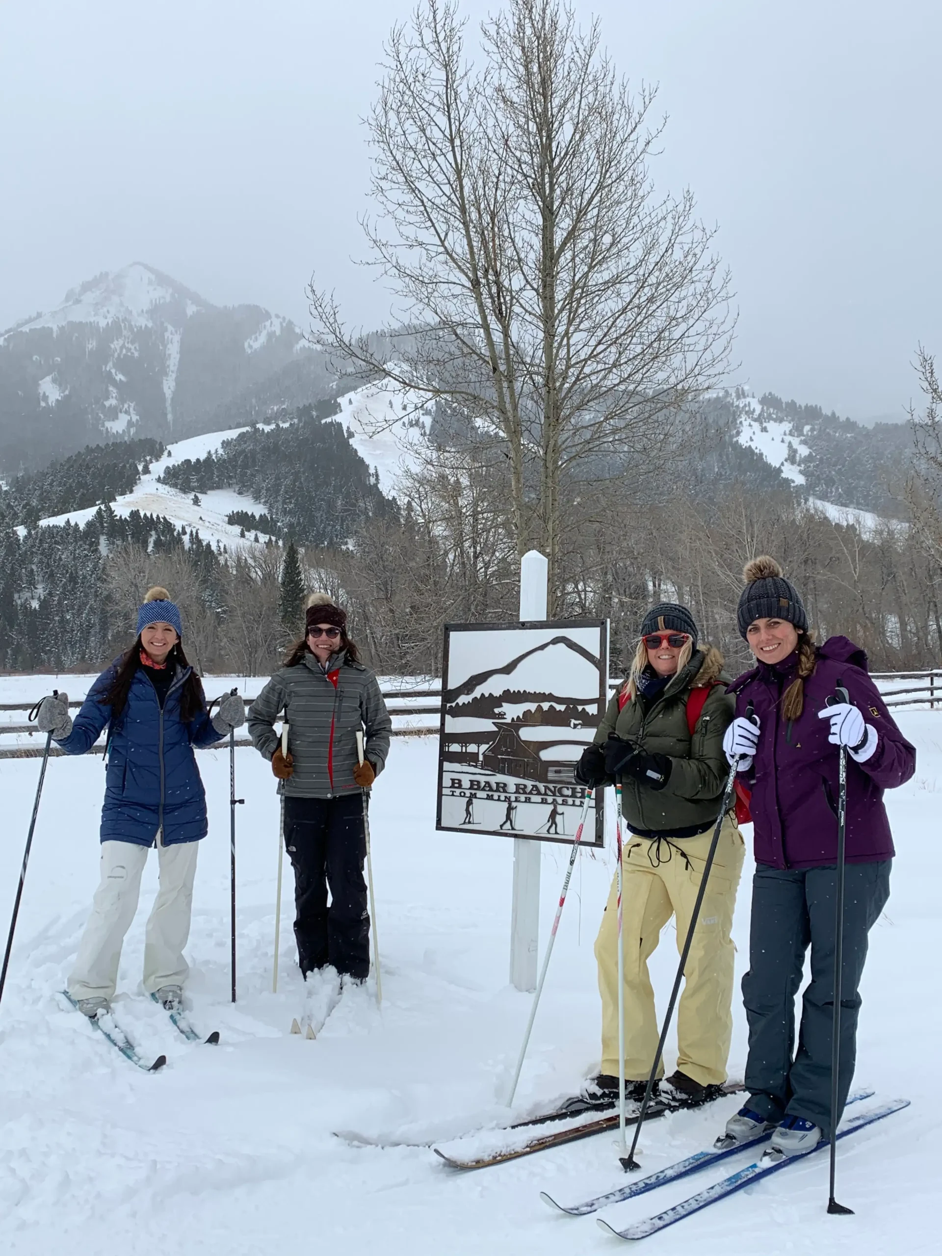 A group of women on skis in the snow.